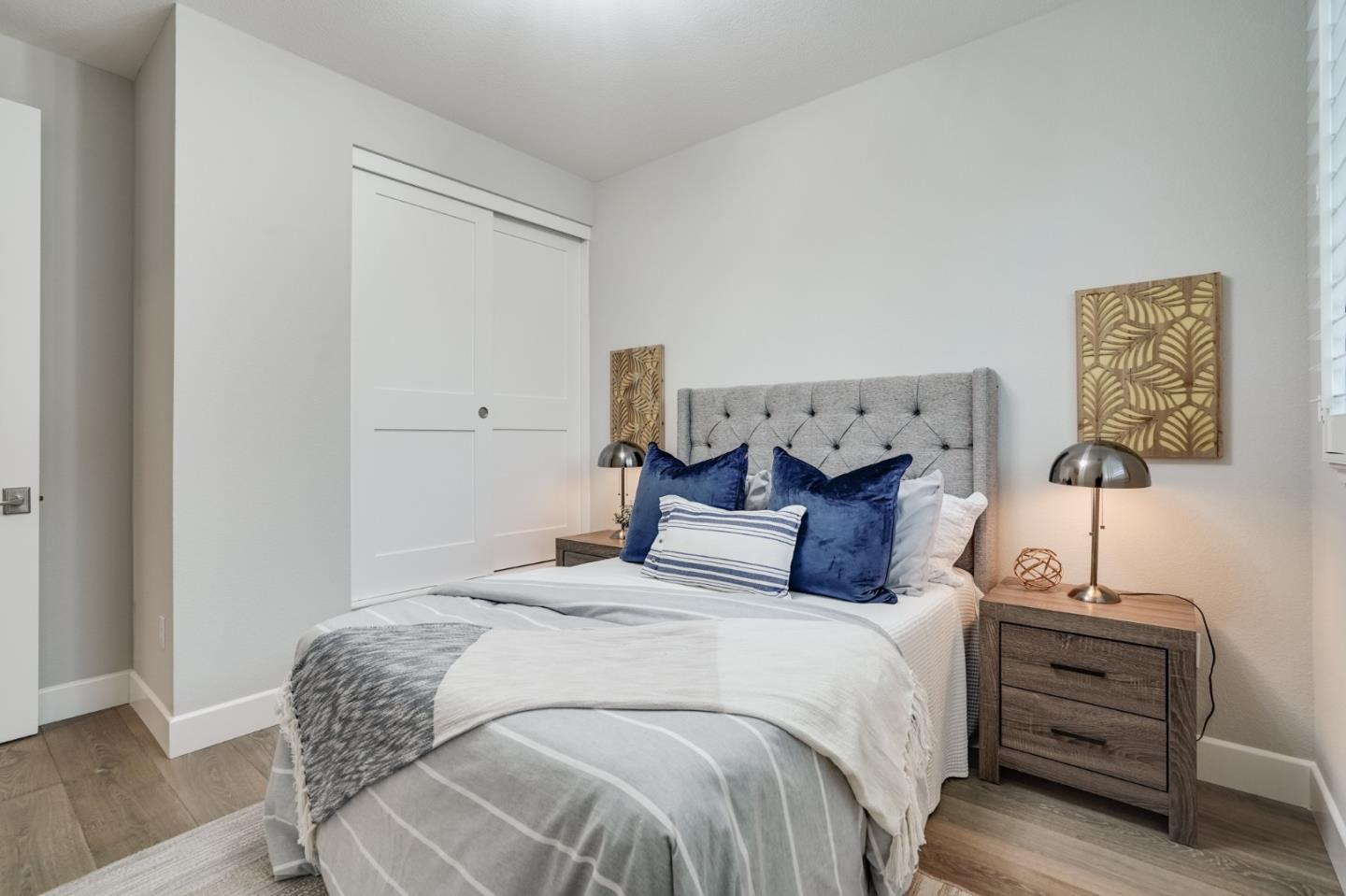 416 Neves Road San Mateo, CA 94403 - Photo 31 of 40 a bedroom with a bed and lamps