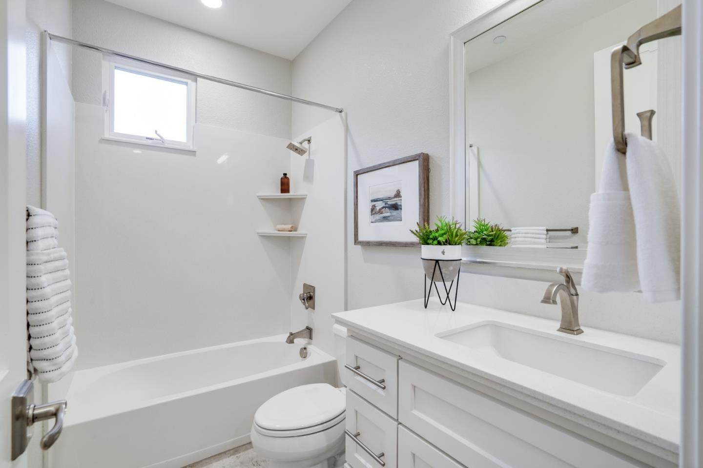 416 Neves Road San Mateo, CA 94403 - Photo 32 of 40 a bathroom with a sink a toilet and shower