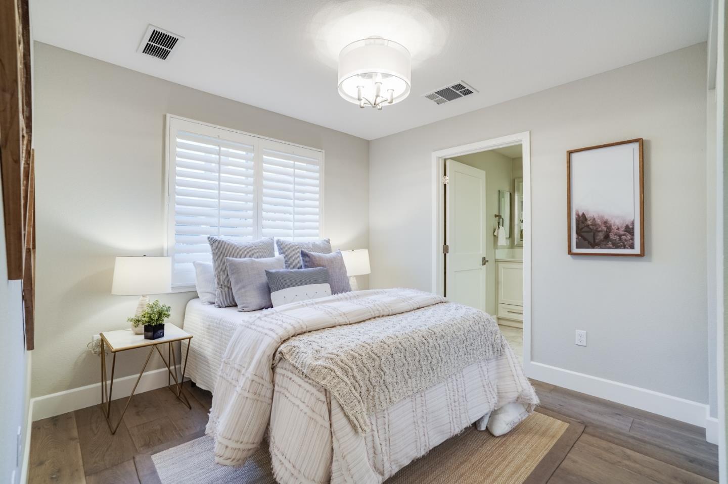 416 Neves Road San Mateo, CA 94403 - Photo 6 of 40 a bedroom with bed and wooden floor