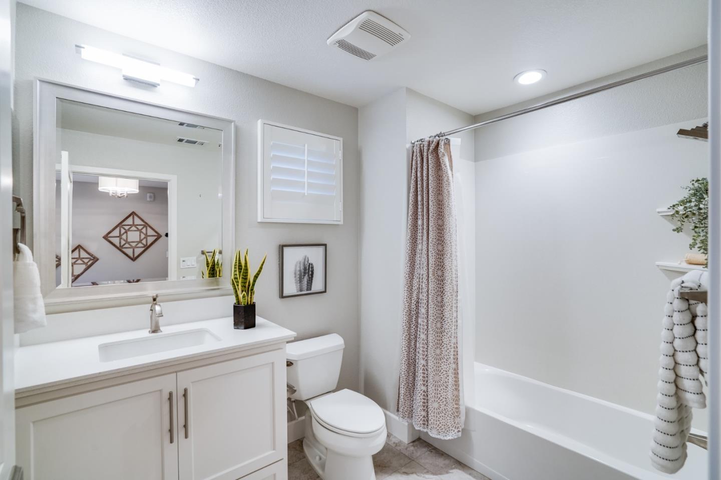 416 Neves Road San Mateo, CA 94403 - Photo 9 of 40 a bathroom with a granite countertop sink a toilet and shower