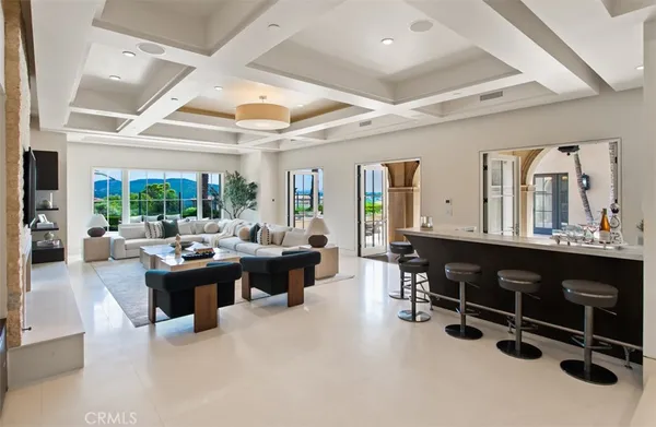 a kitchen with kitchen island a sink table and chairs