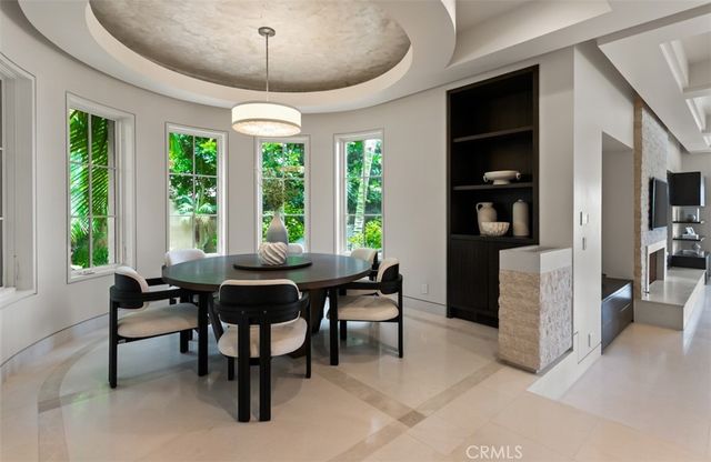 a bedroom with furniture and a large window