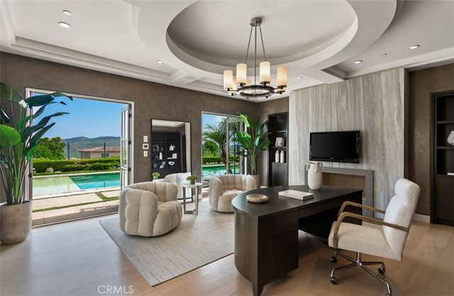 a front view of a house with outdoor seating and a window