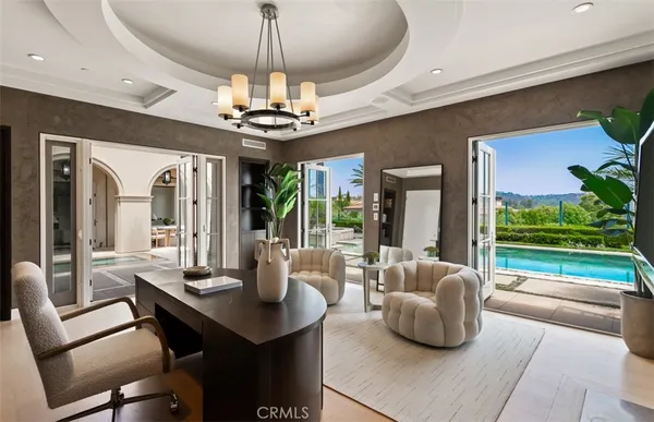 a spacious bathroom with a double vanity sink a mirror and a bathtub