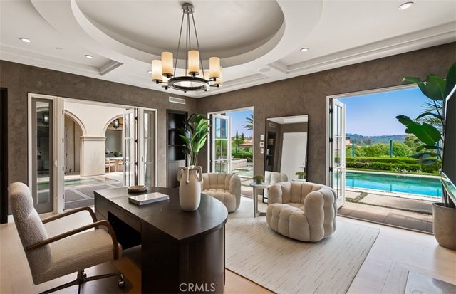 a spacious bathroom with a double vanity sink a mirror and a bathtub