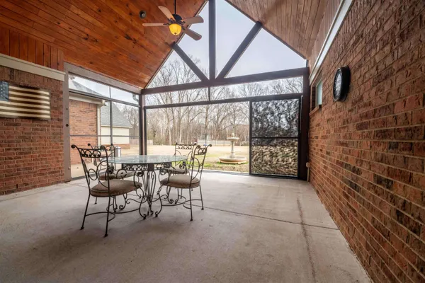 a patio with table and chairs
