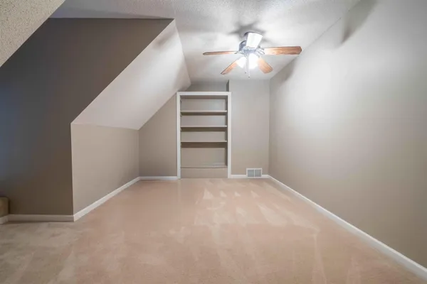 a view of road with large trees