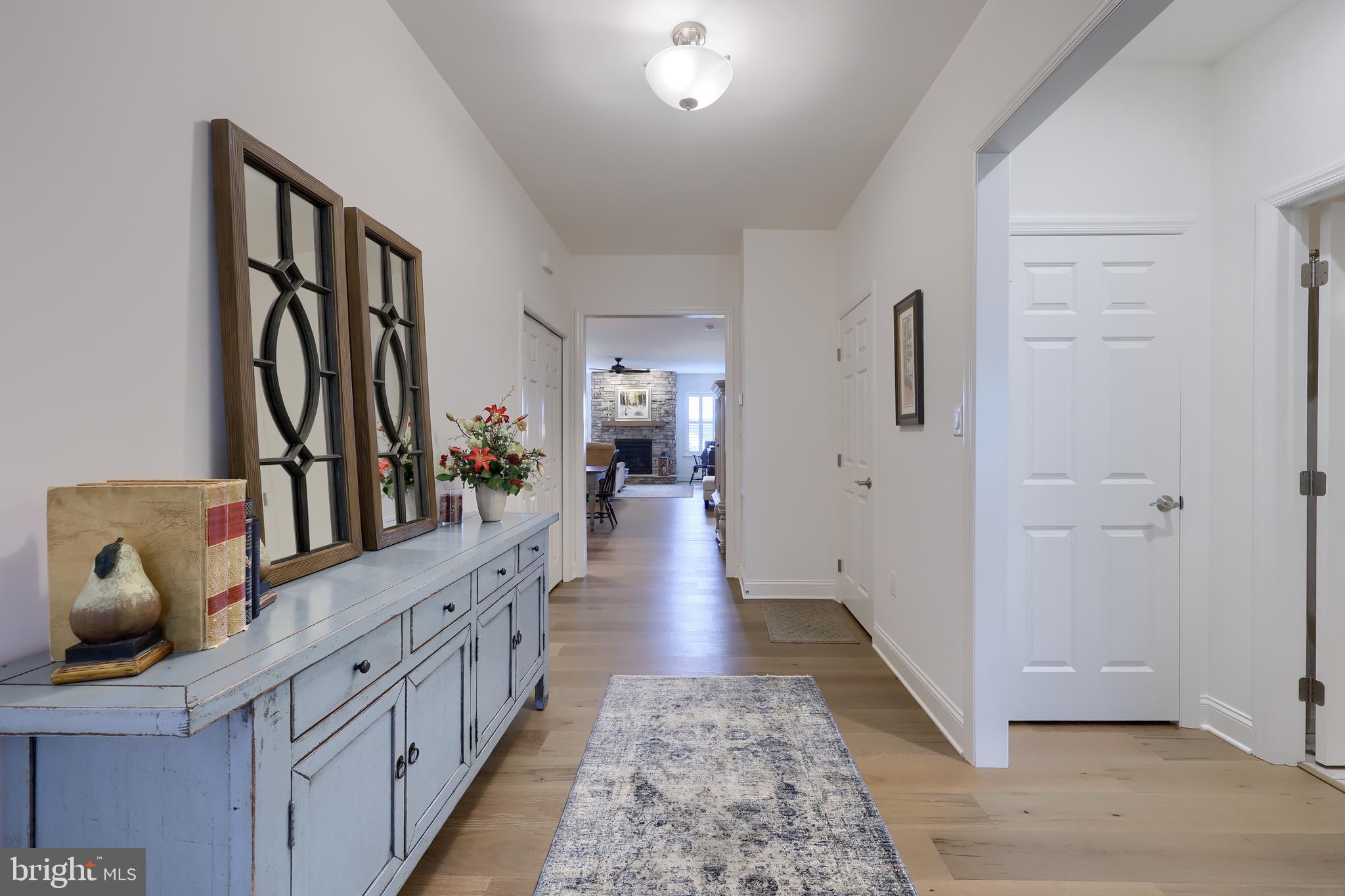 373 Autumn Harvest Lane Lititz, PA 17543 - Photo 2 of 28 a hallway with white cabinets and wooden floor