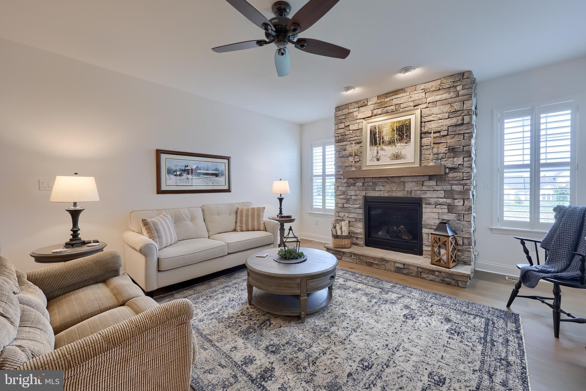 373 Autumn Harvest Lane Lititz, PA 17543 - Photo 4 of 28 a living room with furniture a window and a fireplace