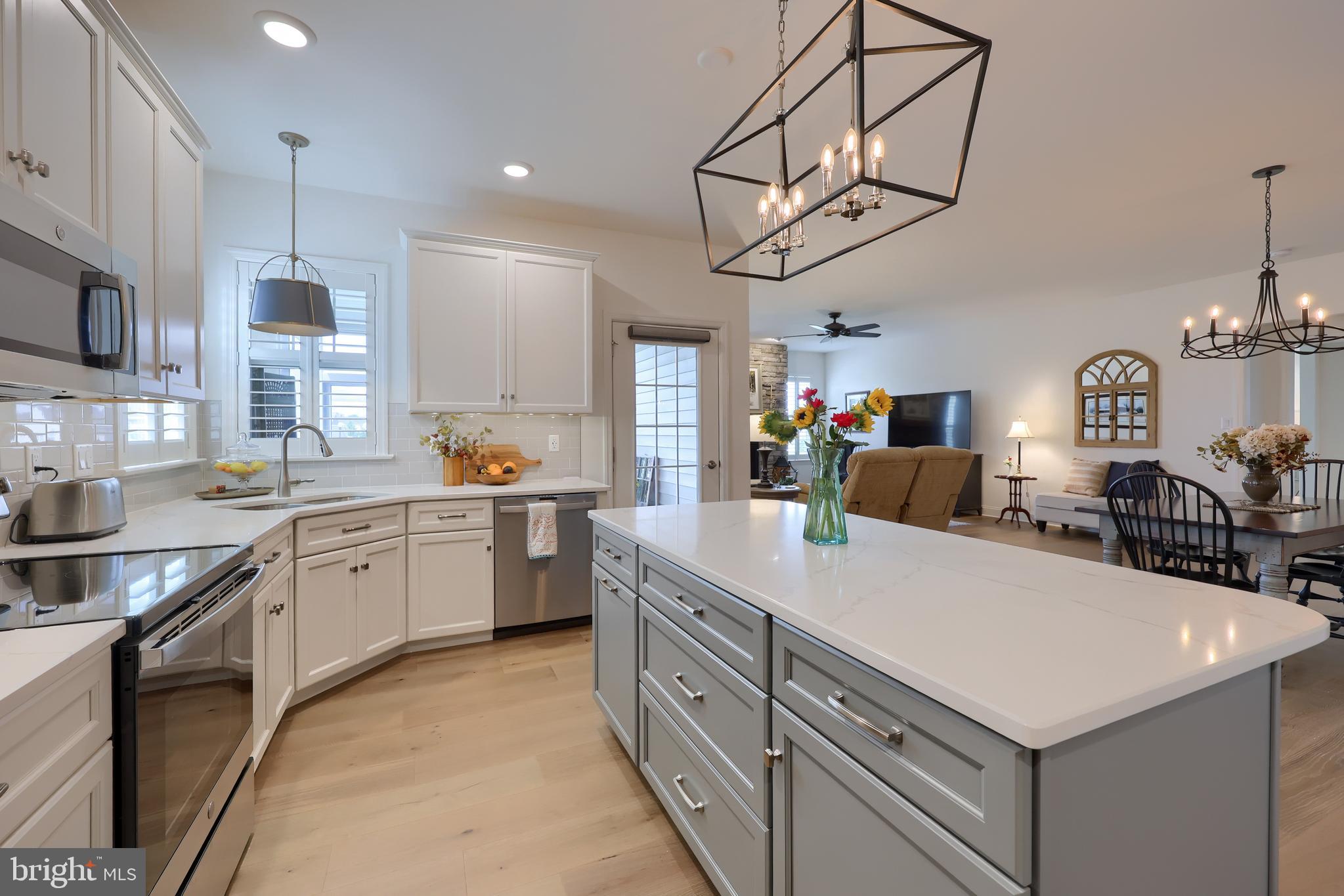 373 Autumn Harvest Lane Lititz, PA 17543 - Photo 7 of 28 a kitchen with kitchen island a sink appliances and cabinets