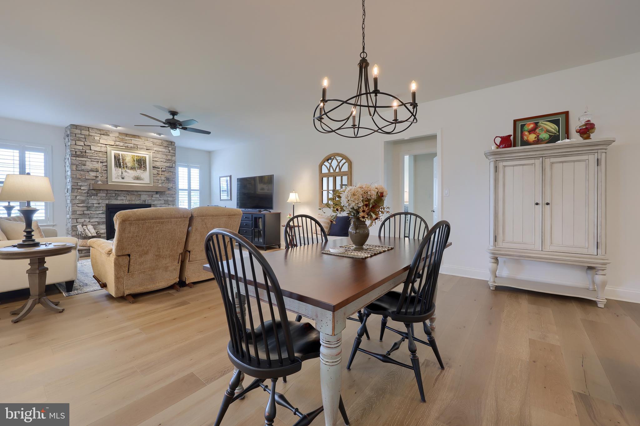 373 Autumn Harvest Lane Lititz, PA 17543 - Photo 9 of 28 a view of a dining room with furniture wooden floor and chandelier