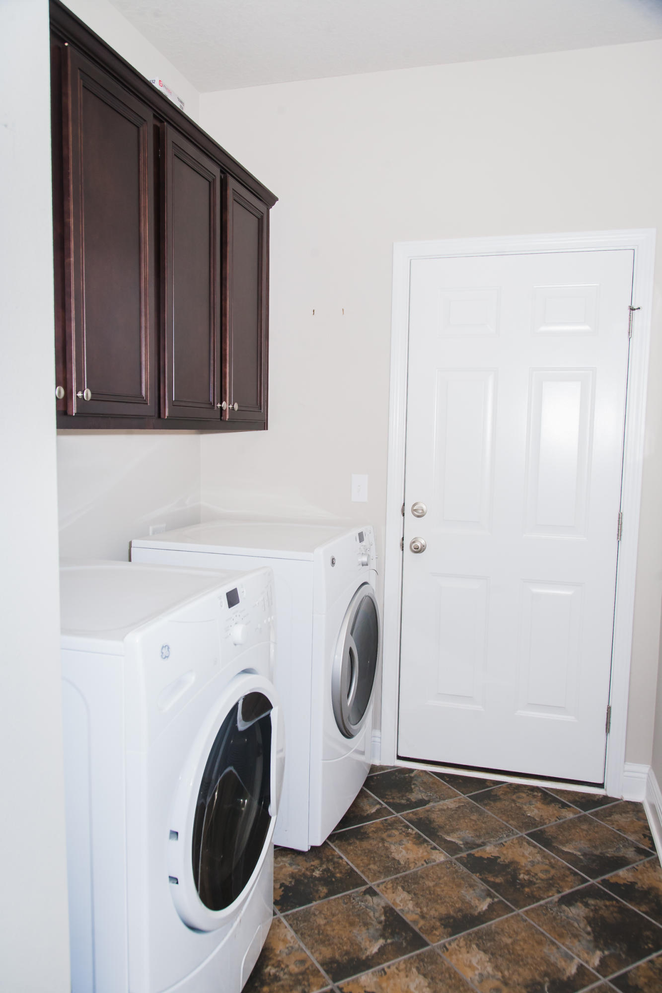282 Whispering Lake Drive Santa Rosa Beach, FL 32459 - Photo 18 of 18 a utility room with dryer and washer
