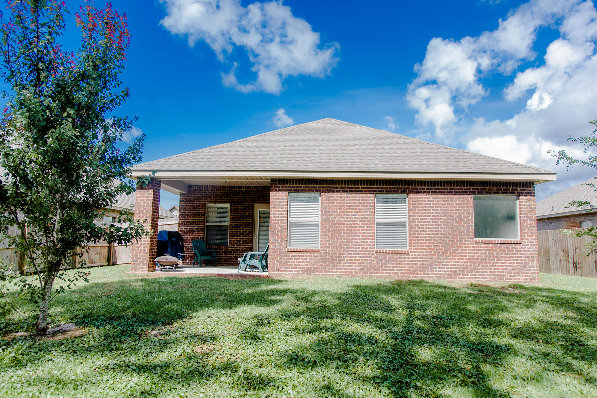 282 Whispering Lake Drive Santa Rosa Beach, FL 32459 - Photo 3 of 18 a front view of a house with a yard