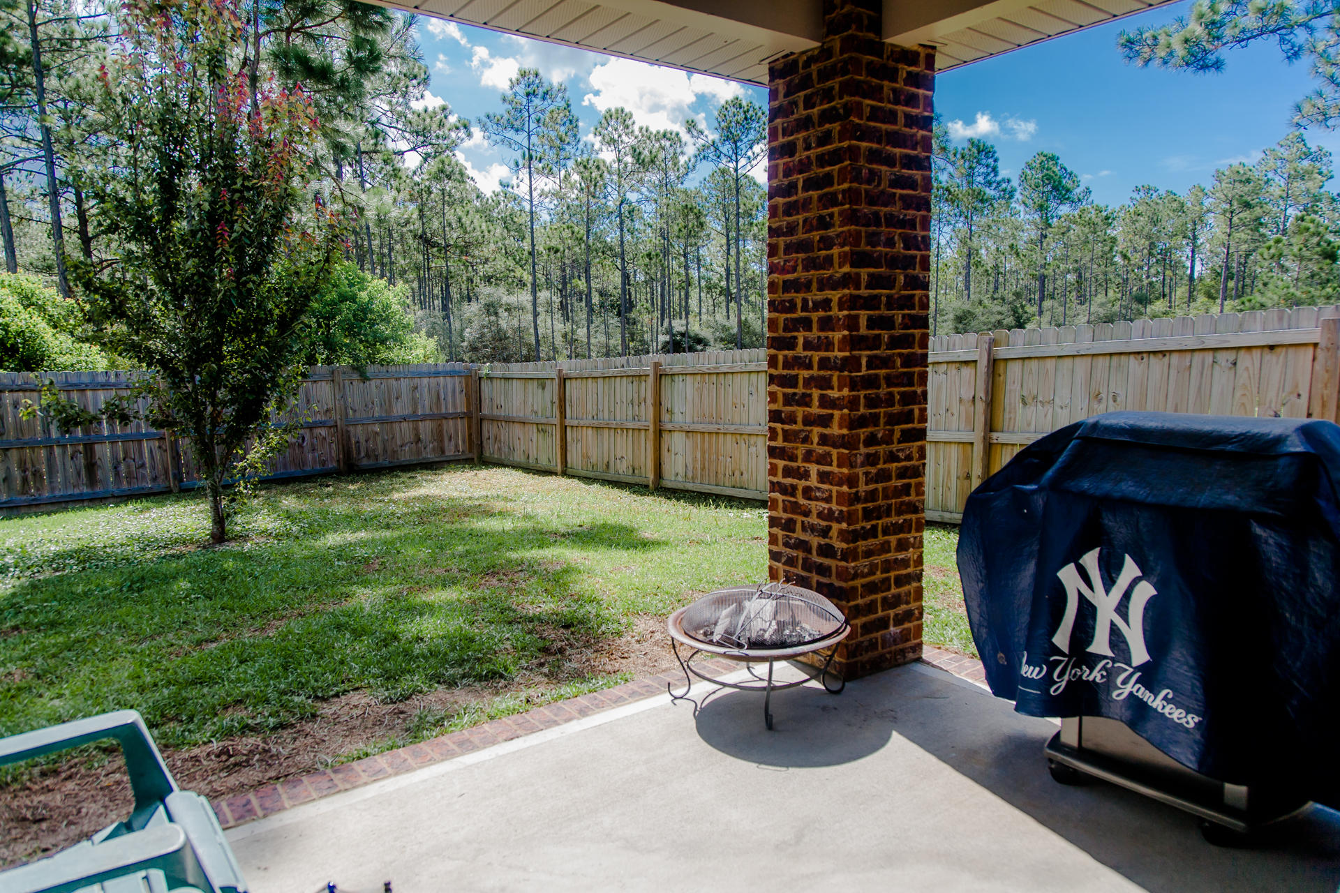 282 Whispering Lake Drive Santa Rosa Beach, FL 32459 - Photo 4 of 18 a view of a porch with furniture and garden