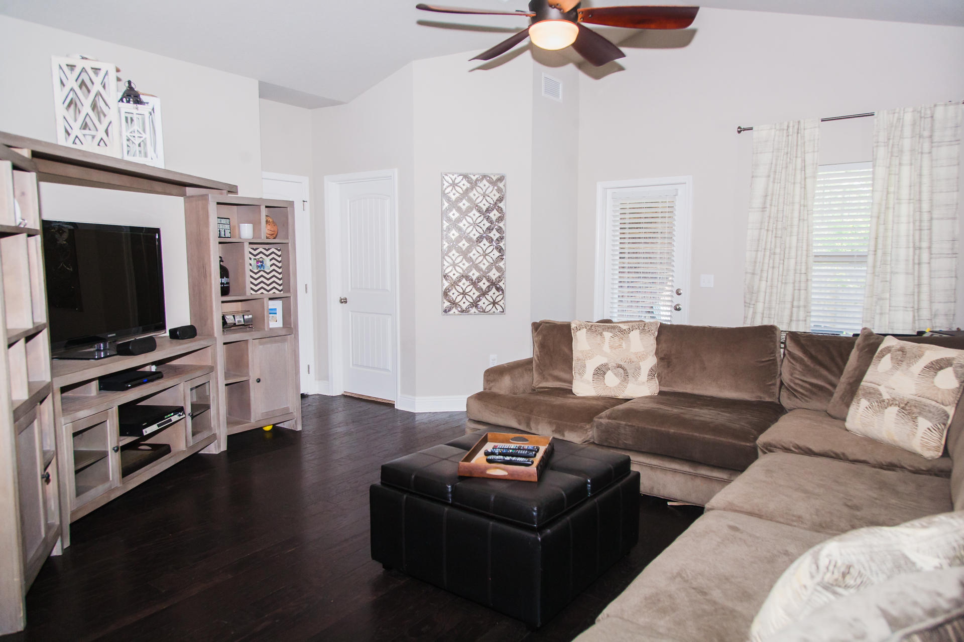 282 Whispering Lake Drive Santa Rosa Beach, FL 32459 - Photo 8 of 18 a living room with furniture and a flat screen tv