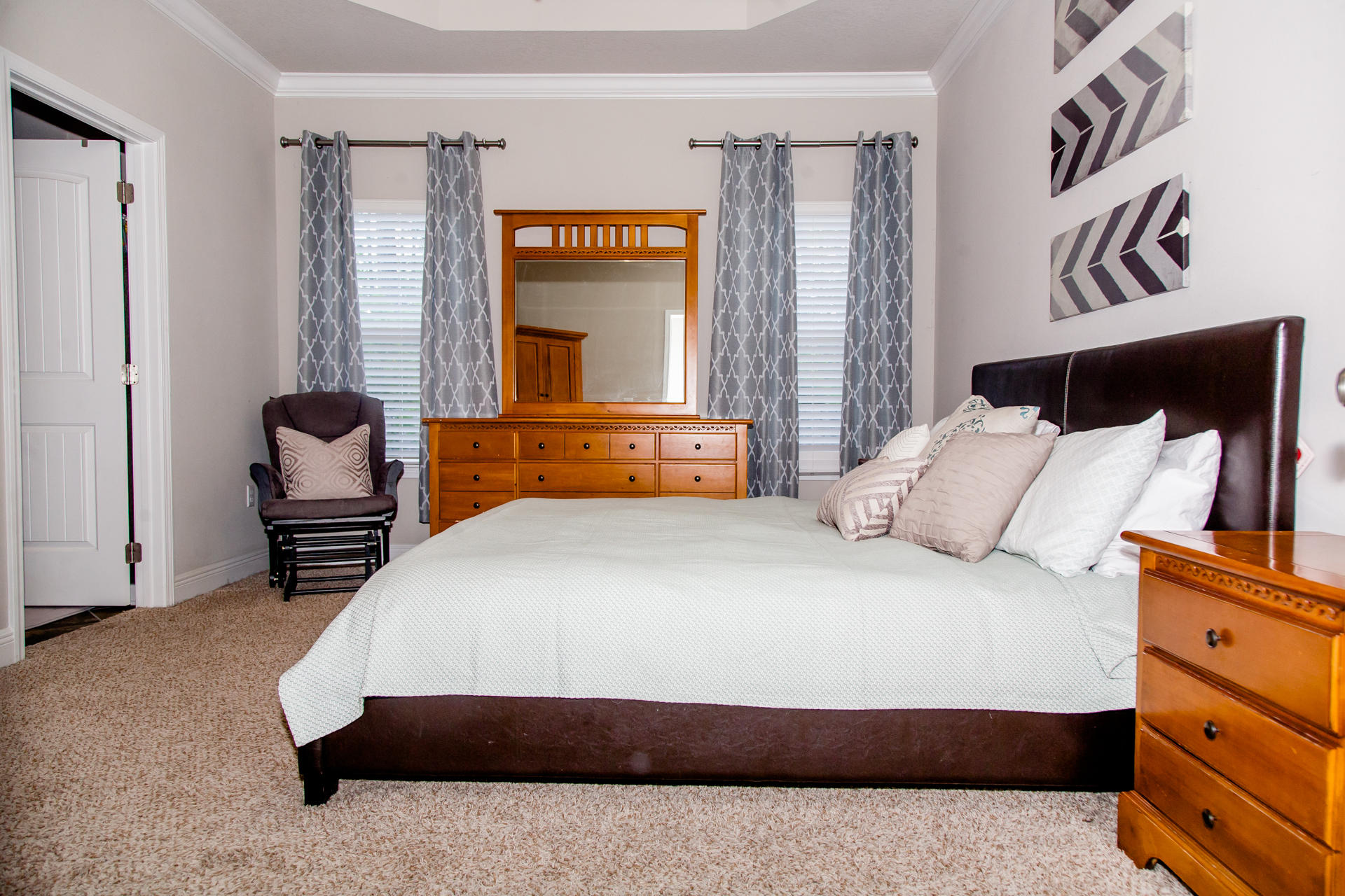 282 Whispering Lake Drive Santa Rosa Beach, FL 32459 - Photo 9 of 18 a bedroom with a bed and wooden floor