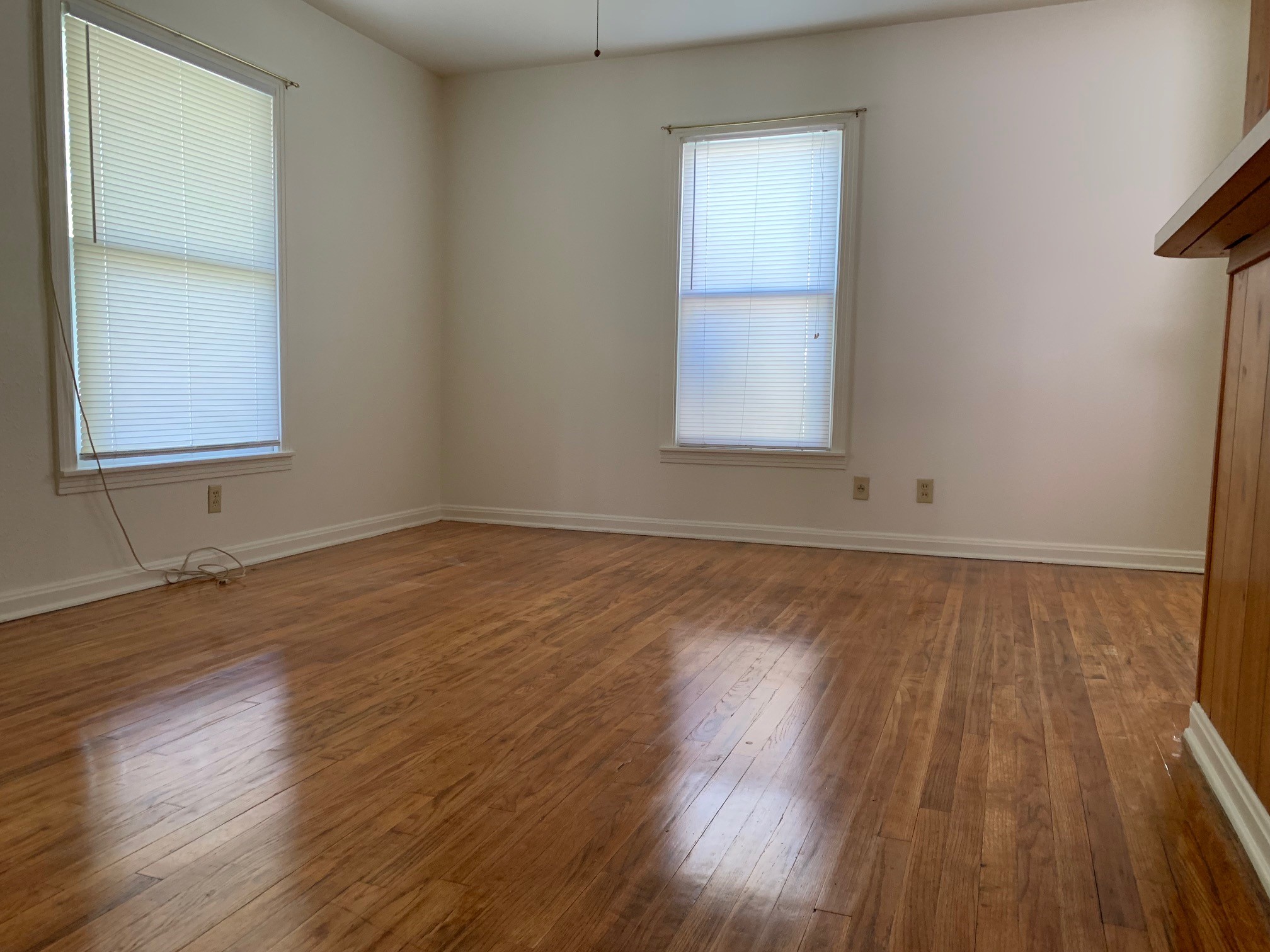 1708 Madison Avenue Austin, TX 78757 - Photo 11 of 20 an empty room with wooden floor and windows