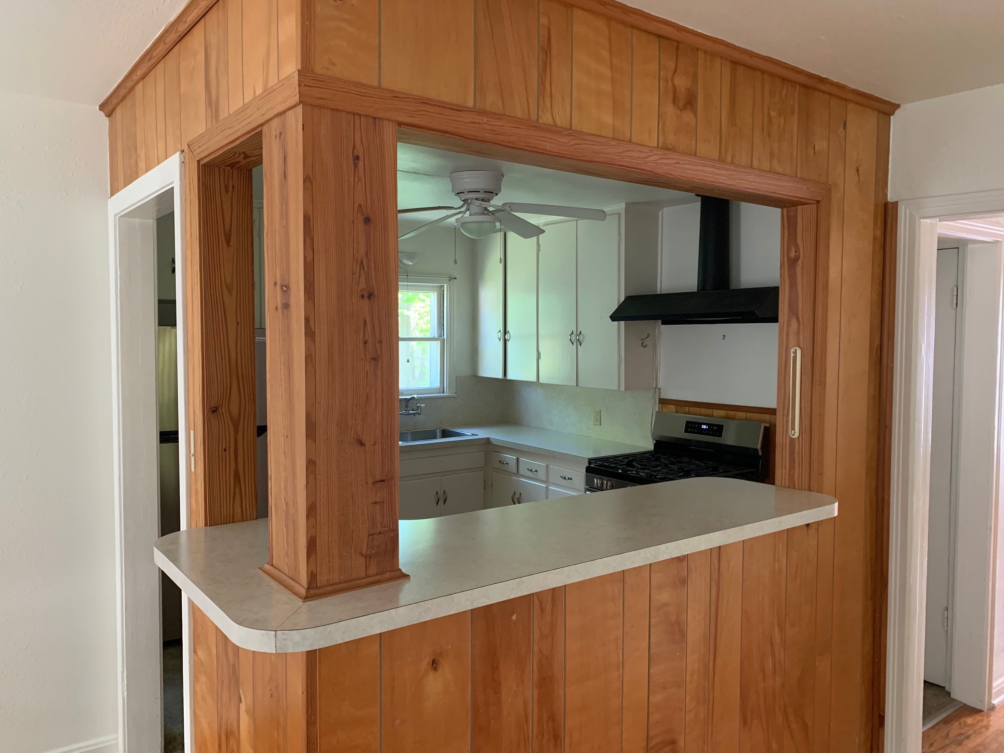 1708 Madison Avenue Austin, TX 78757 - Photo 12 of 20 a kitchen with kitchen island a sink and a refrigerator