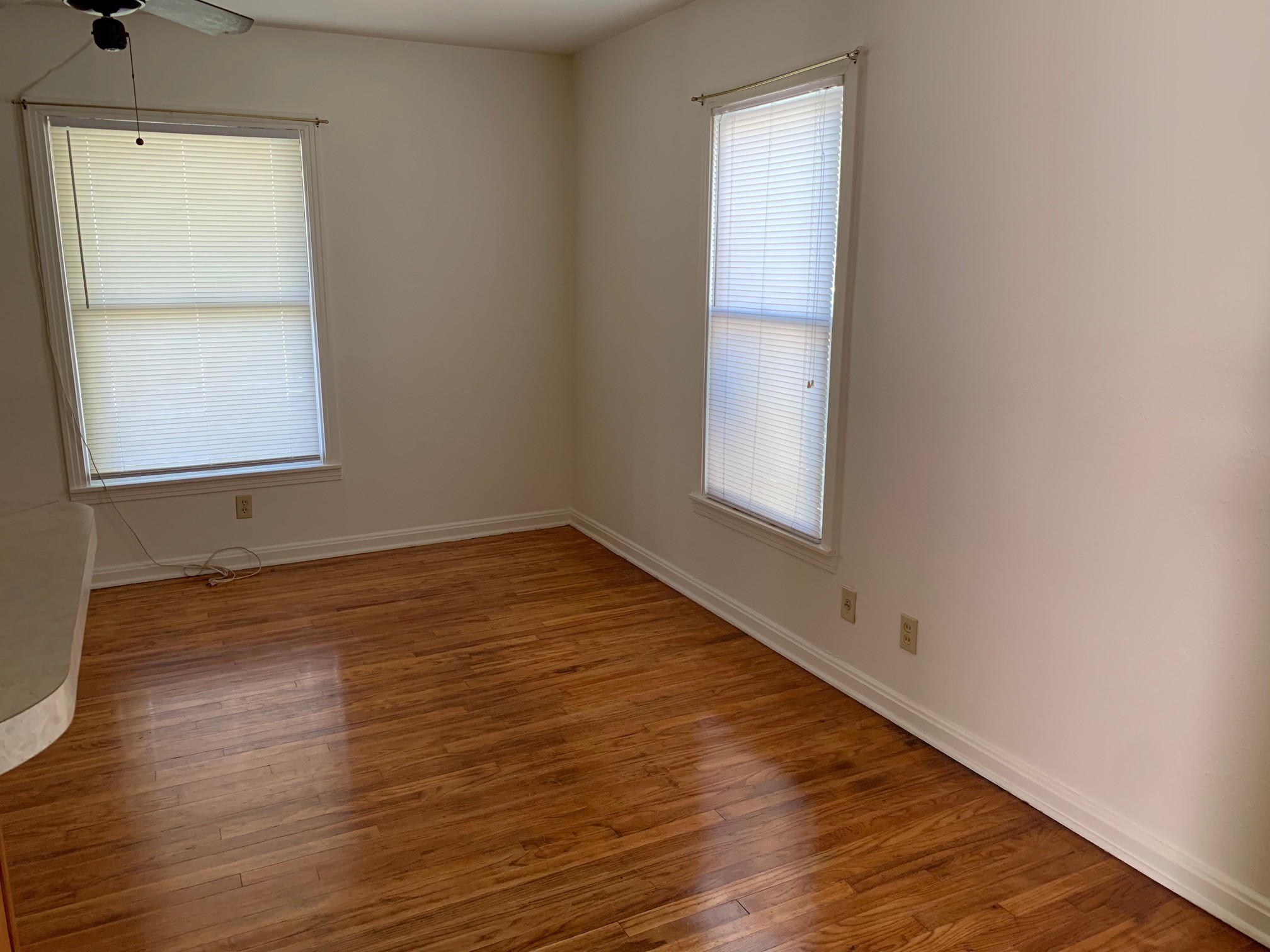 1708 Madison Avenue Austin, TX 78757 - Photo 5 of 20 an empty room with wooden floor and windows