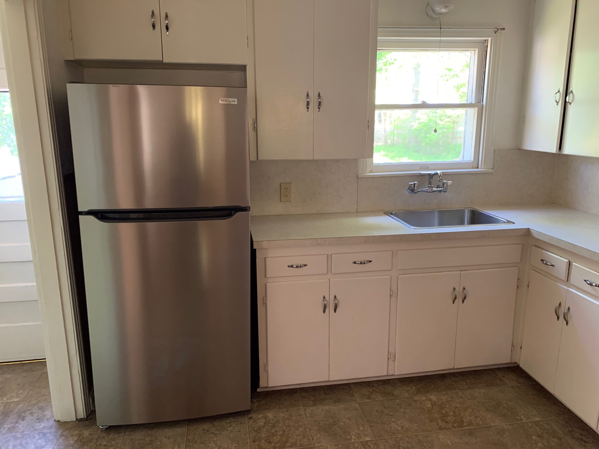 1708 Madison Avenue Austin, TX 78757 - Photo 6 of 20 a white refrigerator freezer sitting in a kitchen