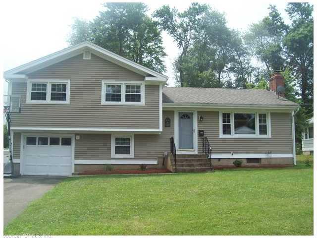 155 Dale Road Wethersfield, CT 06109 - Photo 1 of 1 a front view of a house with a yard