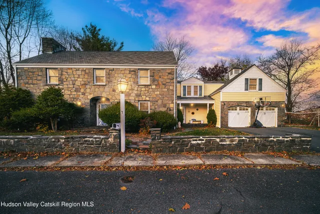 a front view of a house with street