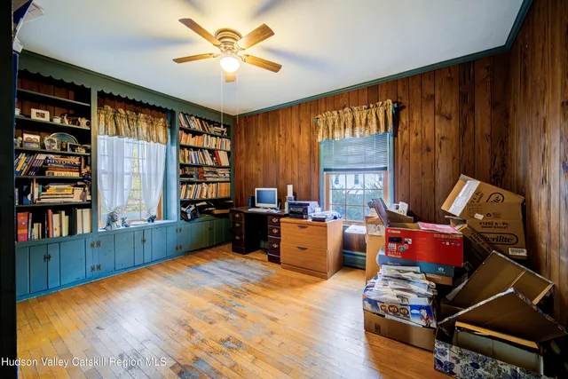 a bedroom with furniture and a window