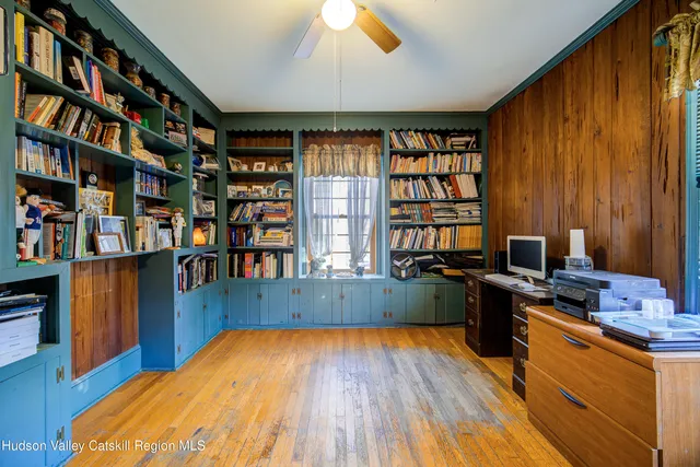 a workspace with furniture and wooden floor