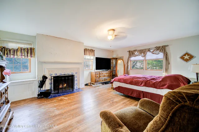 a living room with a couch and a fireplace
