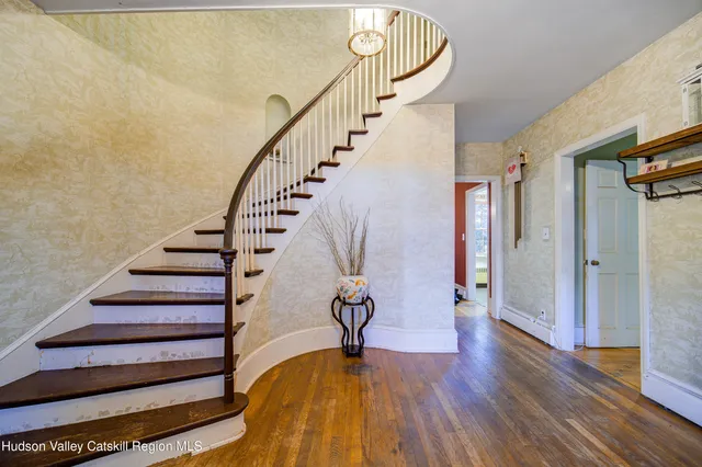 a view of entryway with wooden floor