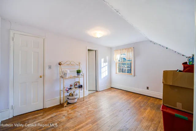 a view of a livingroom with wooden floor
