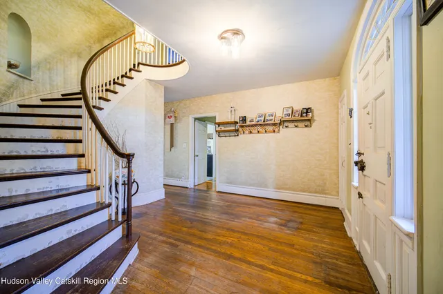 a view of entryway with wooden floor