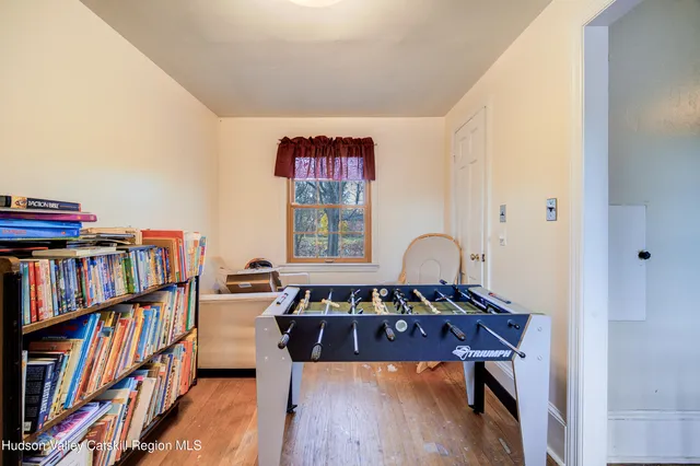 a view of a workspace with furniture and toys