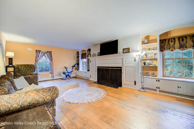 a view of a livingroom with furniture and a fireplace