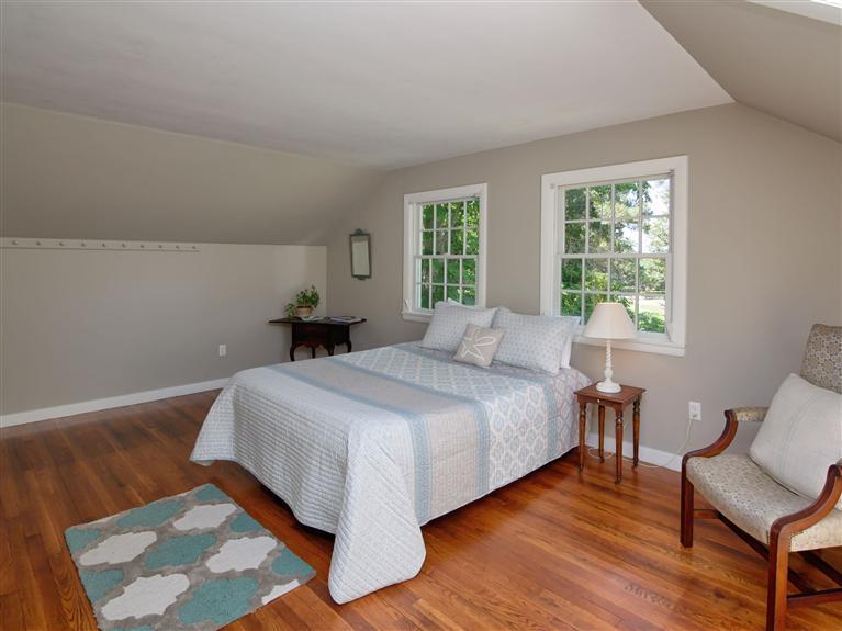 84 Old Dock Road Falmouth, MA 02540 - Photo 12 of 19 a bedroom with a bed and wooden floor