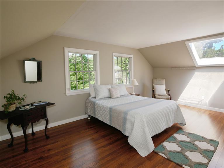 84 Old Dock Road Falmouth, MA 02540 - Photo 13 of 19 a bedroom with a bed table chair and a window