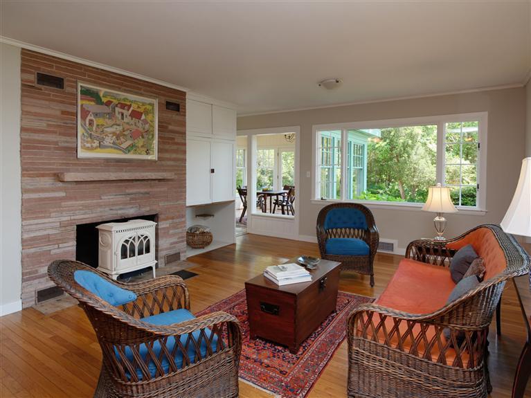 84 Old Dock Road Falmouth, MA 02540 - Photo 5 of 19 a living room with furniture a fireplace and a large window