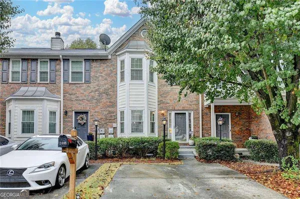 a front view of a house with garden
