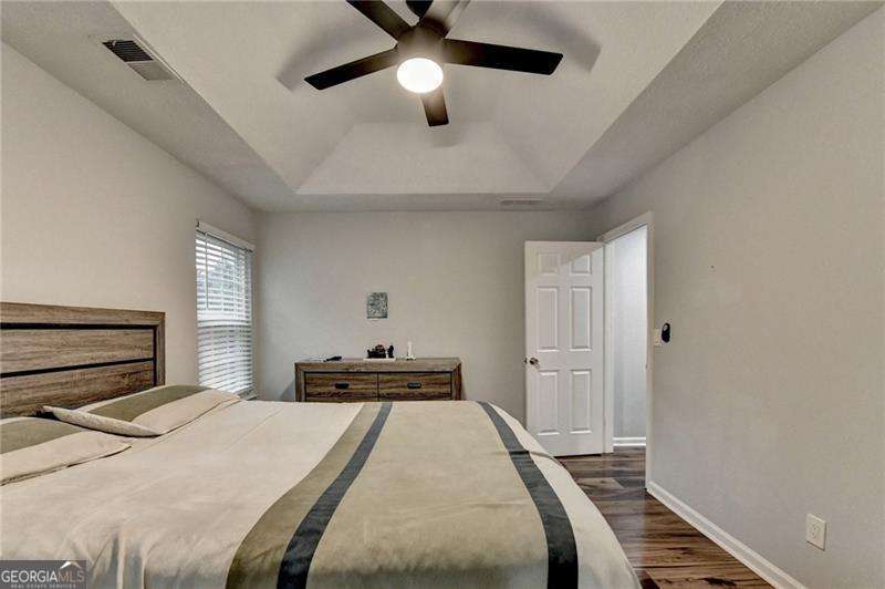 2066 Pinnacle Pointe Drive Norcross, GA 30071 - Photo 34 of 56 a bedroom with a bed and a chandelier