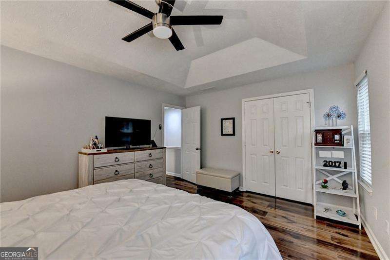 2066 Pinnacle Pointe Drive Norcross, GA 30071 - Photo 42 of 56 a bedroom with a bed and a flat screen tv