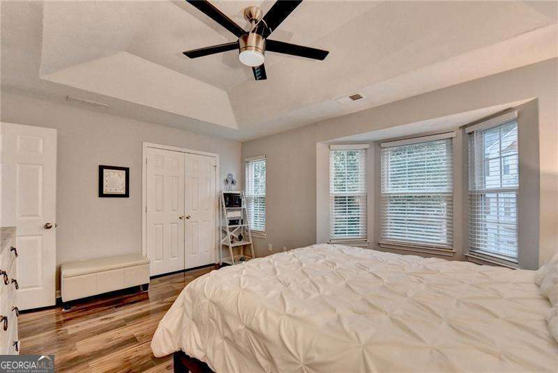 2066 Pinnacle Pointe Drive Norcross, GA 30071 - Photo 43 of 56 a bedroom with a large bed and a window