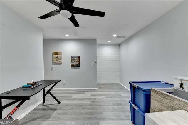 a view of a wooden chairs in patio of a house