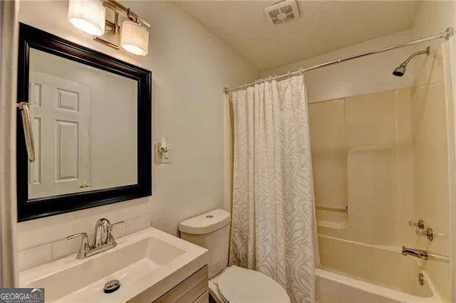 a view of a two chairs with table in the balcony