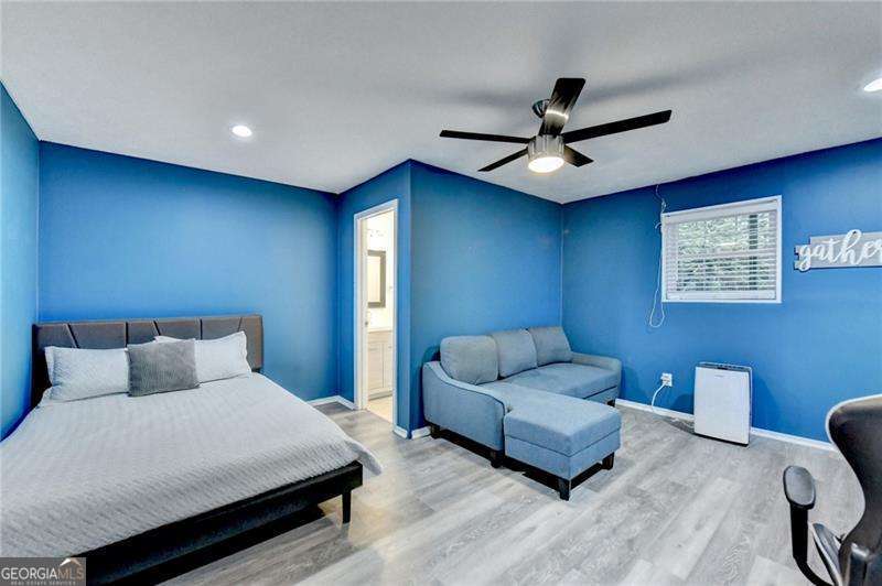 2066 Pinnacle Pointe Drive Norcross, GA 30071 - Photo 51 of 56 a bedroom with furniture and a ceiling fan