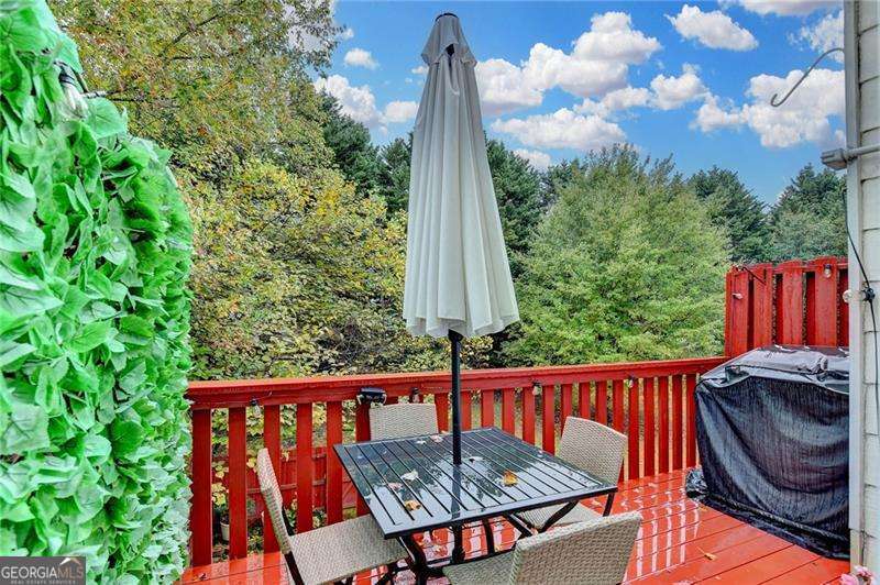 2066 Pinnacle Pointe Drive Norcross, GA 30071 - Photo 55 of 56 a view of a wooden chairs in patio of a house
