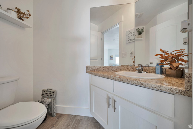 11730 South Shadow Lane Draper, UT 84020 - Photo 18 of 24 Half bathroom with vanity and light wood finished floors