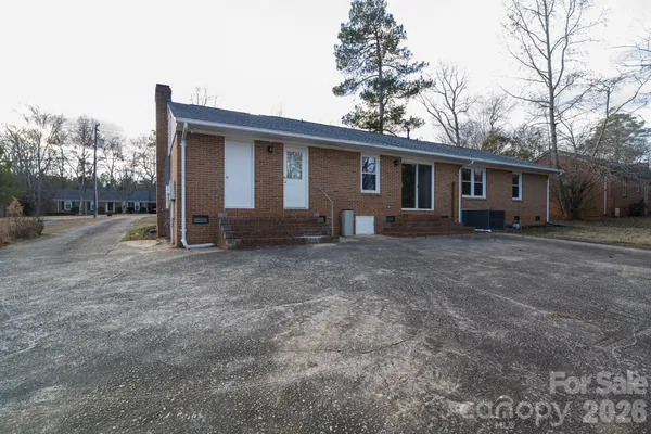 a house view with a backyard space