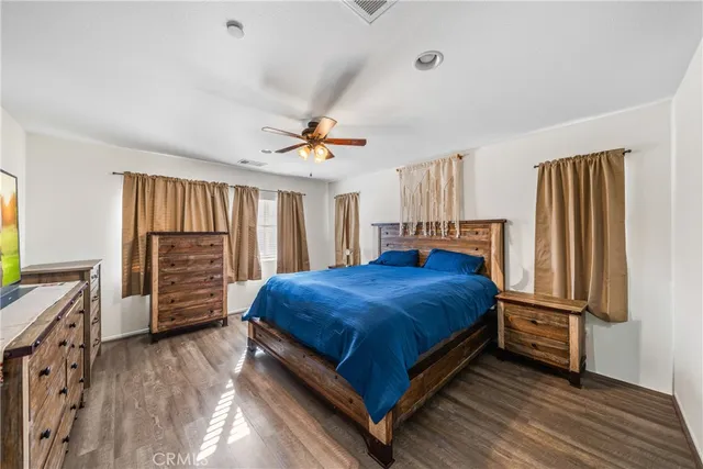 a bed room with a bed and dresser