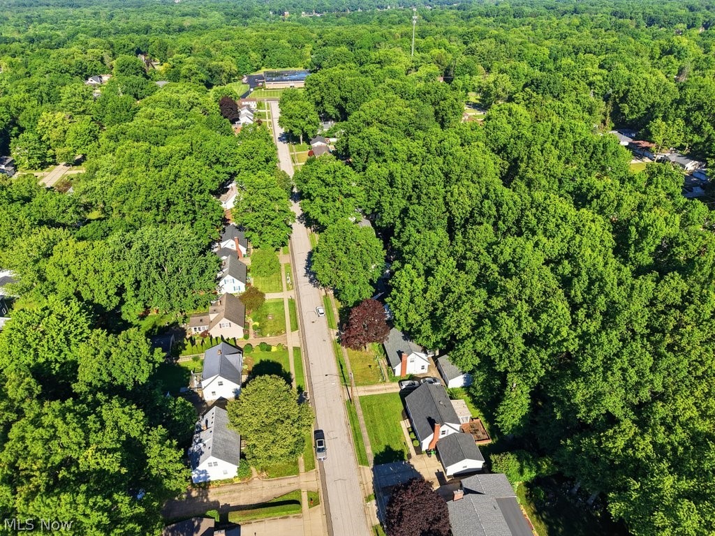 136 Pinehurst Road Munroe Falls, OH 44262 - Photo 47 of 48 Aerial perspective of a tree-lined residential area featuring single-story homes and a paved street