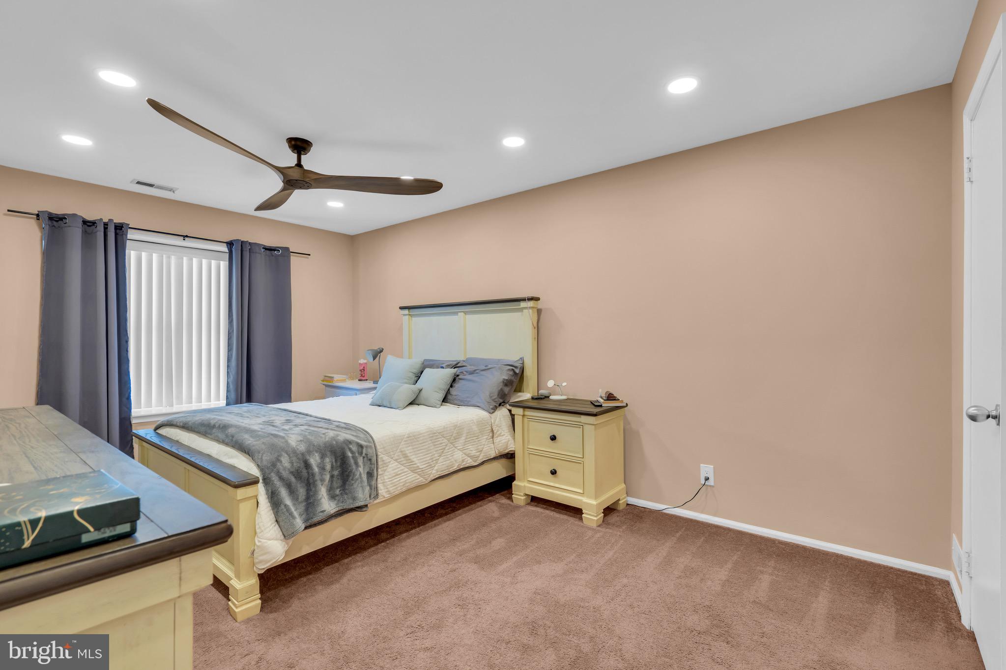 1508 B Ralston Drive Mount Laurel, NJ 08054 - Photo 21 of 29 a spacious bedroom with a bed and a ceiling fan